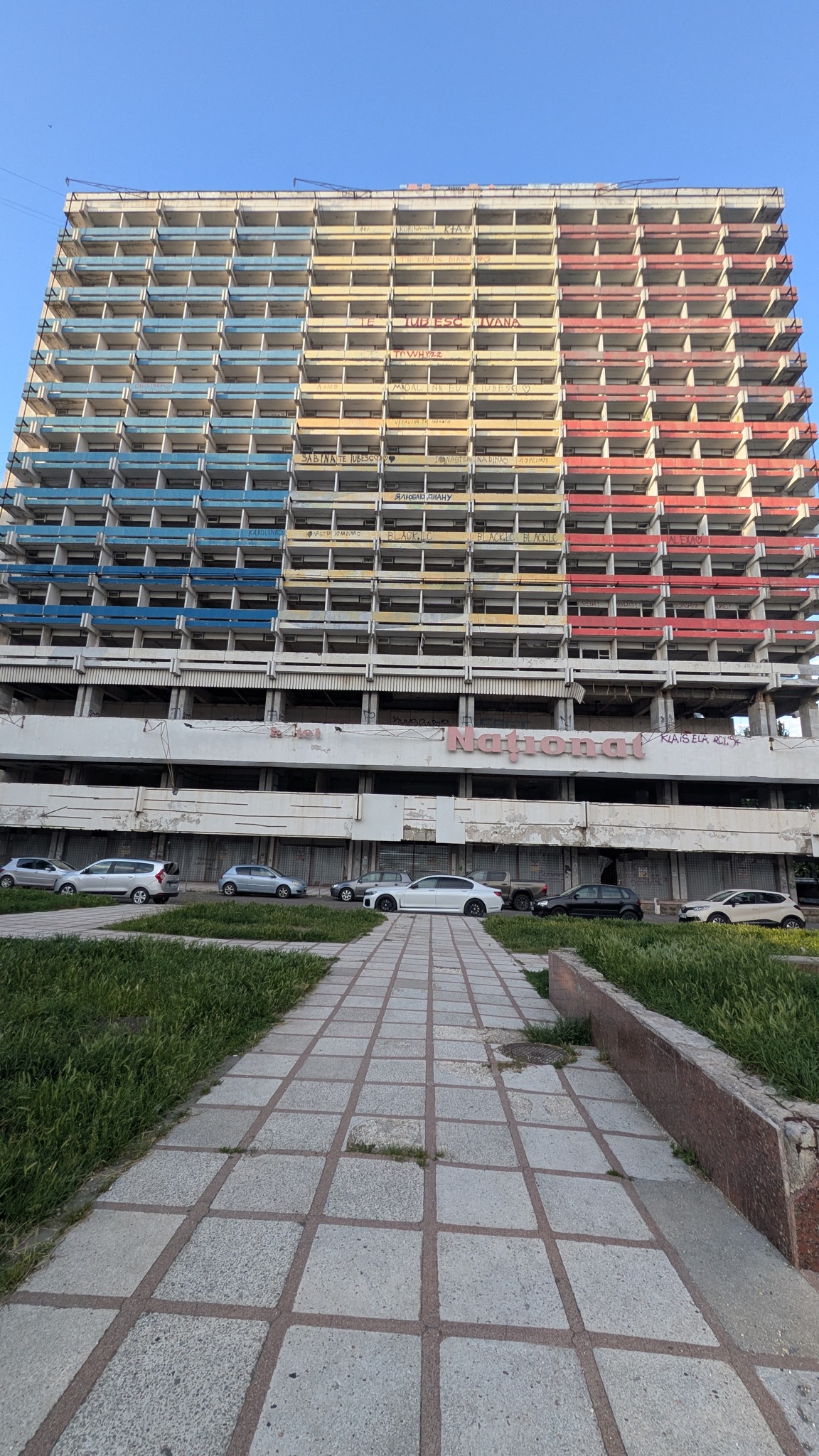 The abandoned National Hotel in Chisinau, its balconies painted in the blue, yellow and red of the Moldovan flag