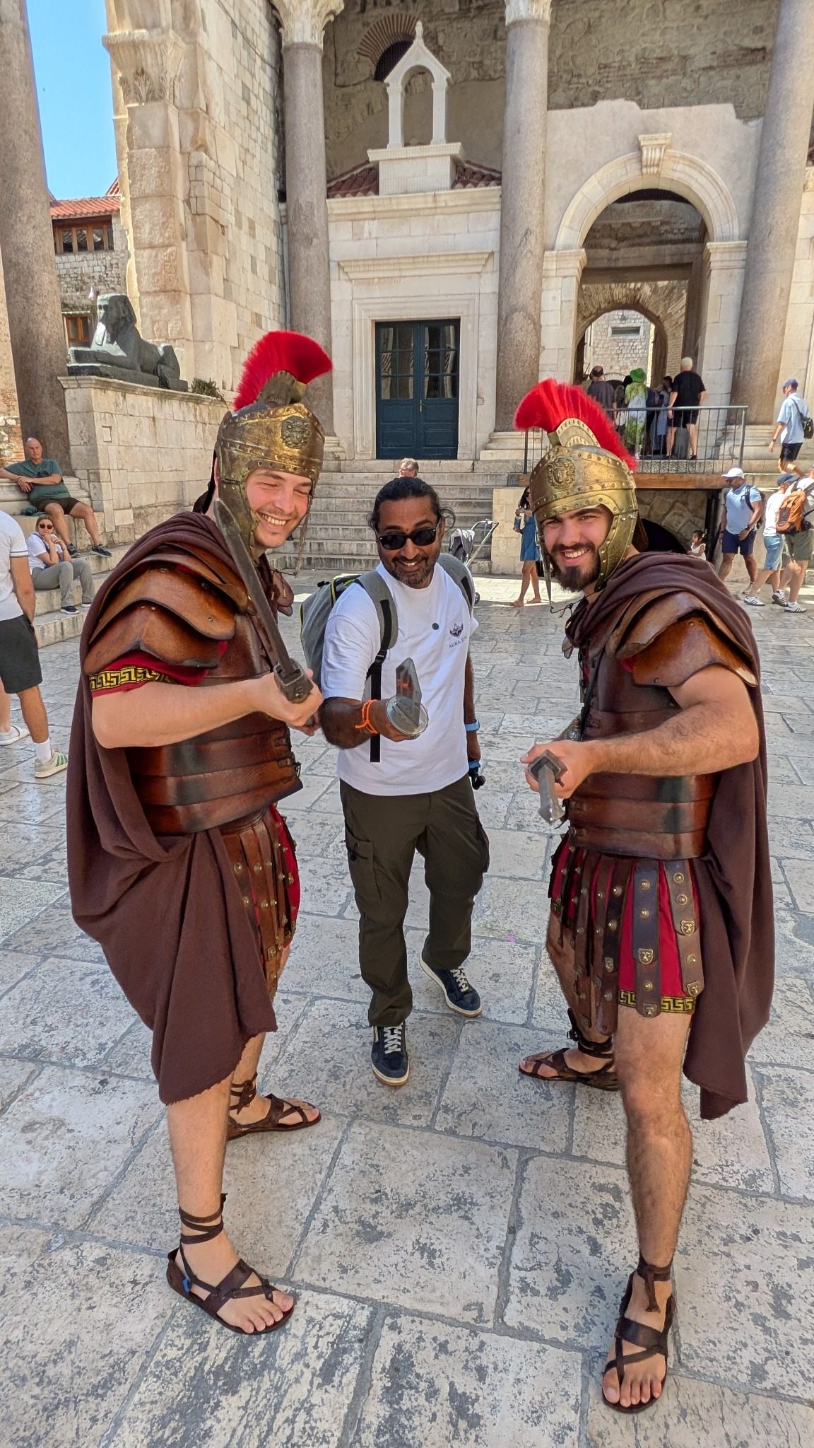 Saki The Wanderer posing with Roman soldier performers inside Diocletian's Palace in Split
